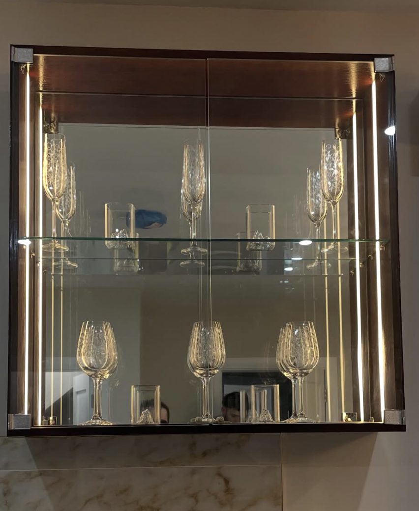 Illuminated glass display cabinet